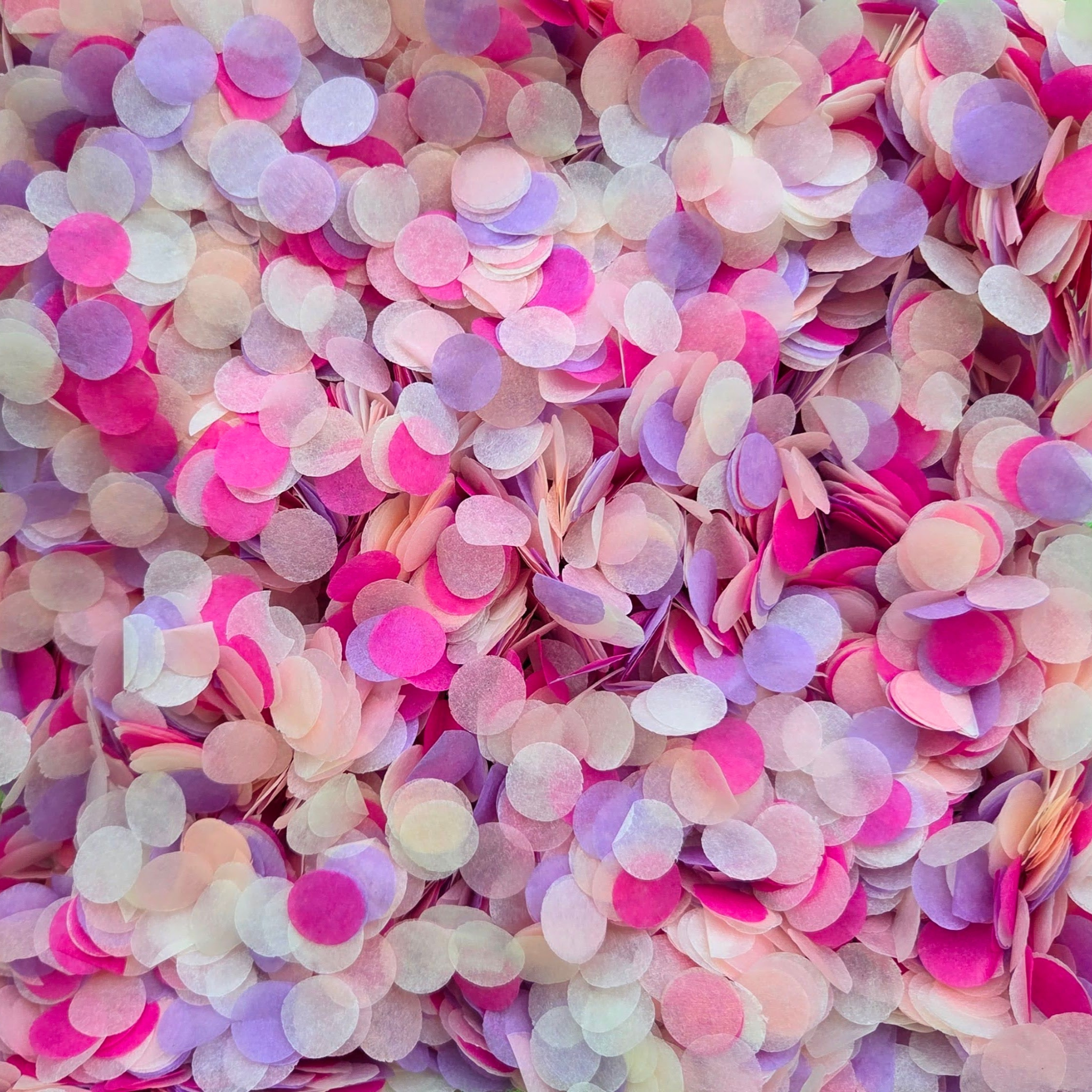 Close-up of pastel pink, peach, purple, and ivory confetti circles