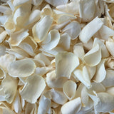 A close-up pile of dried ivory cream rose petals.