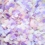 Close up of confetti colour and texture in blush pink, lilac and ivory. 