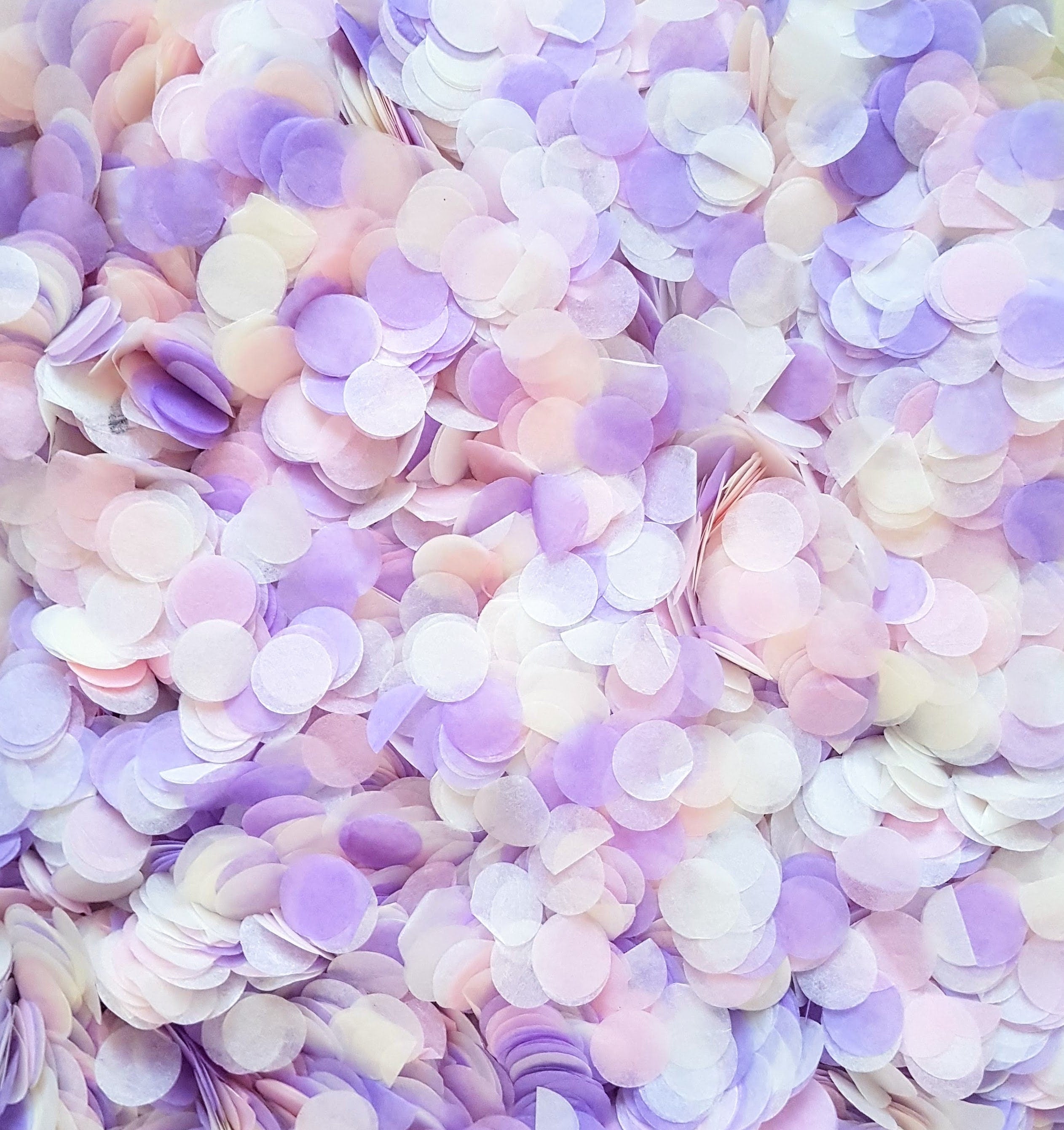 Close up of confetti colour and texture in blush pink, lilac and ivory. 
